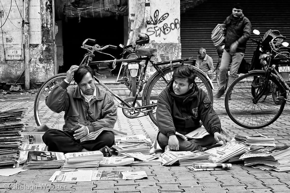 Sorting Newspapers, Early Morning, Delhi by Shelagh Wooster